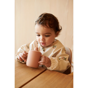 Merle Long Sleeve Bib | Peach/Sea shell mix - Liewood